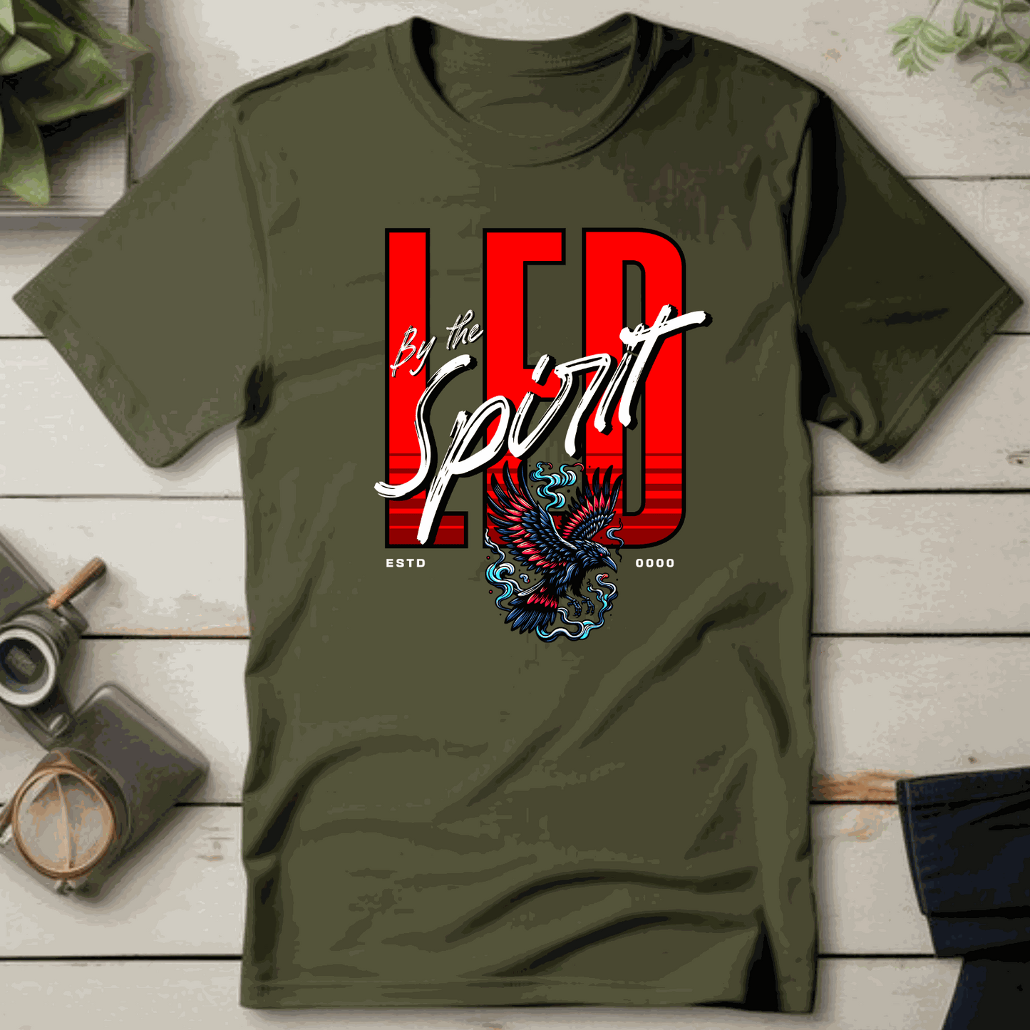 Christian LED unisex T-shirt with "LED by the Spirit" design featuring an eagle graphic on olive fabric