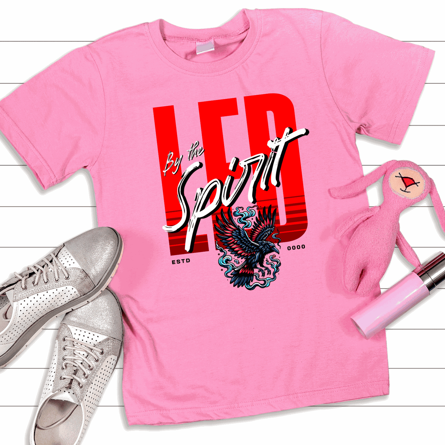 Christian LED Unisex pink t-shirt with "LED by the Spirit" text and eagle graphic, made from US cotton, casual and religious wear.