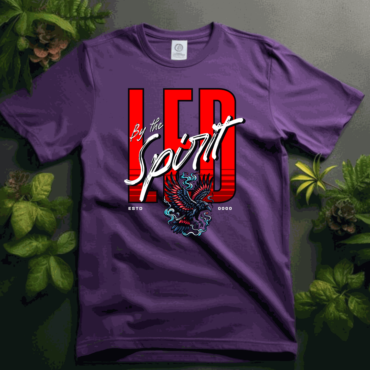 Christian LED Unisex purple t-shirt with "LED by the Spirit" text and eagle graphic, made of soft cotton blend.
