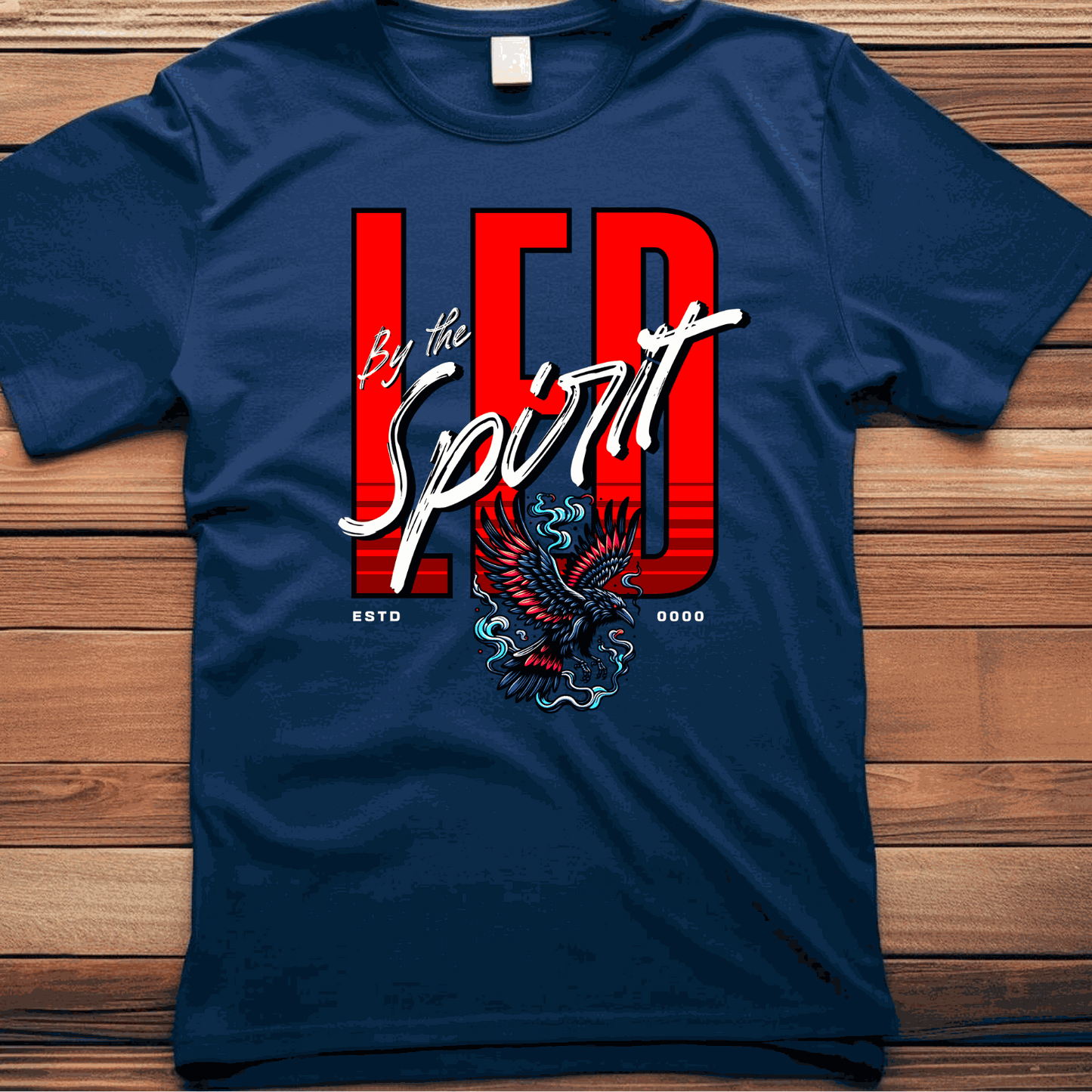 Christian LED Unisex T-shirt with red "LED by the Spirit" text and eagle graphic on navy fabric
